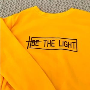 Yellow and black shirt with words